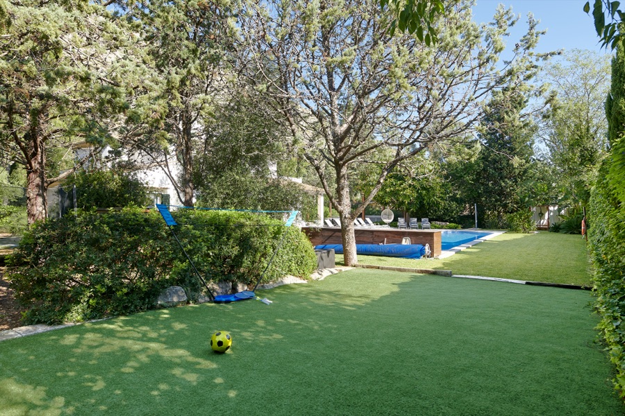 The astro-turf play lawn and swimming pool