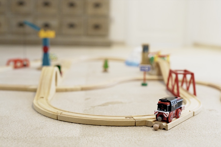 A wooden train set in the children's playroom