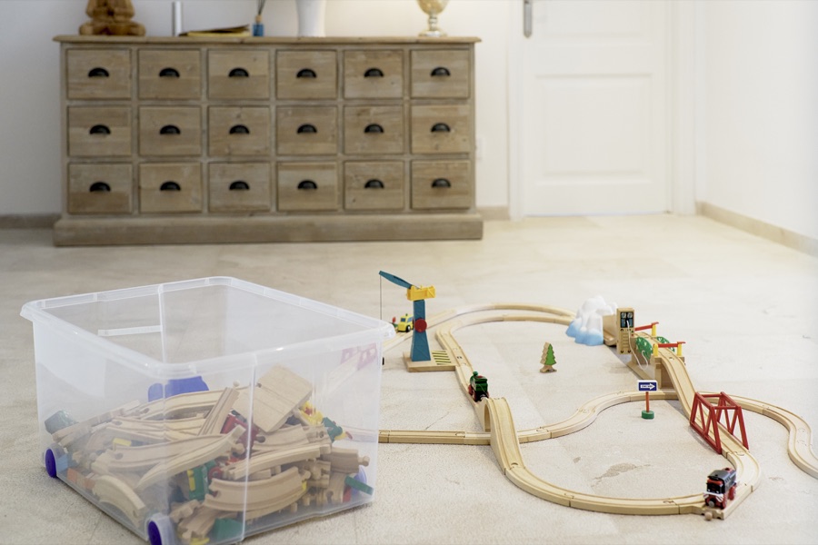 Children's toys and train set in the playroom