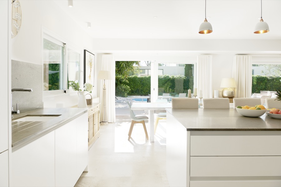 The high-spec white kitchen and breakfast bar