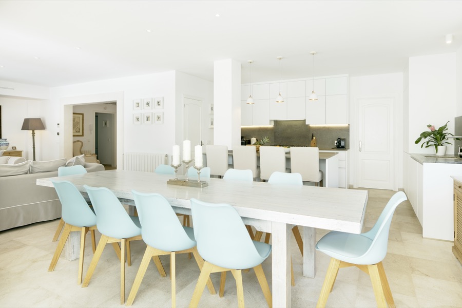 The dining table and open-plan kitchen and living area